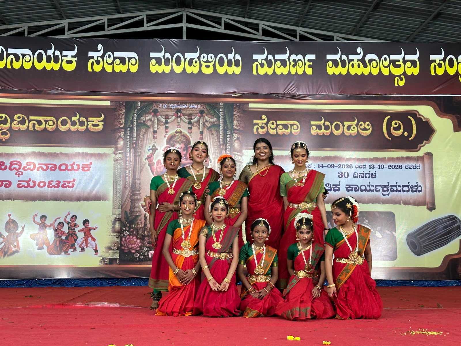 Bharatanatyam dancers and their teacher together on stage